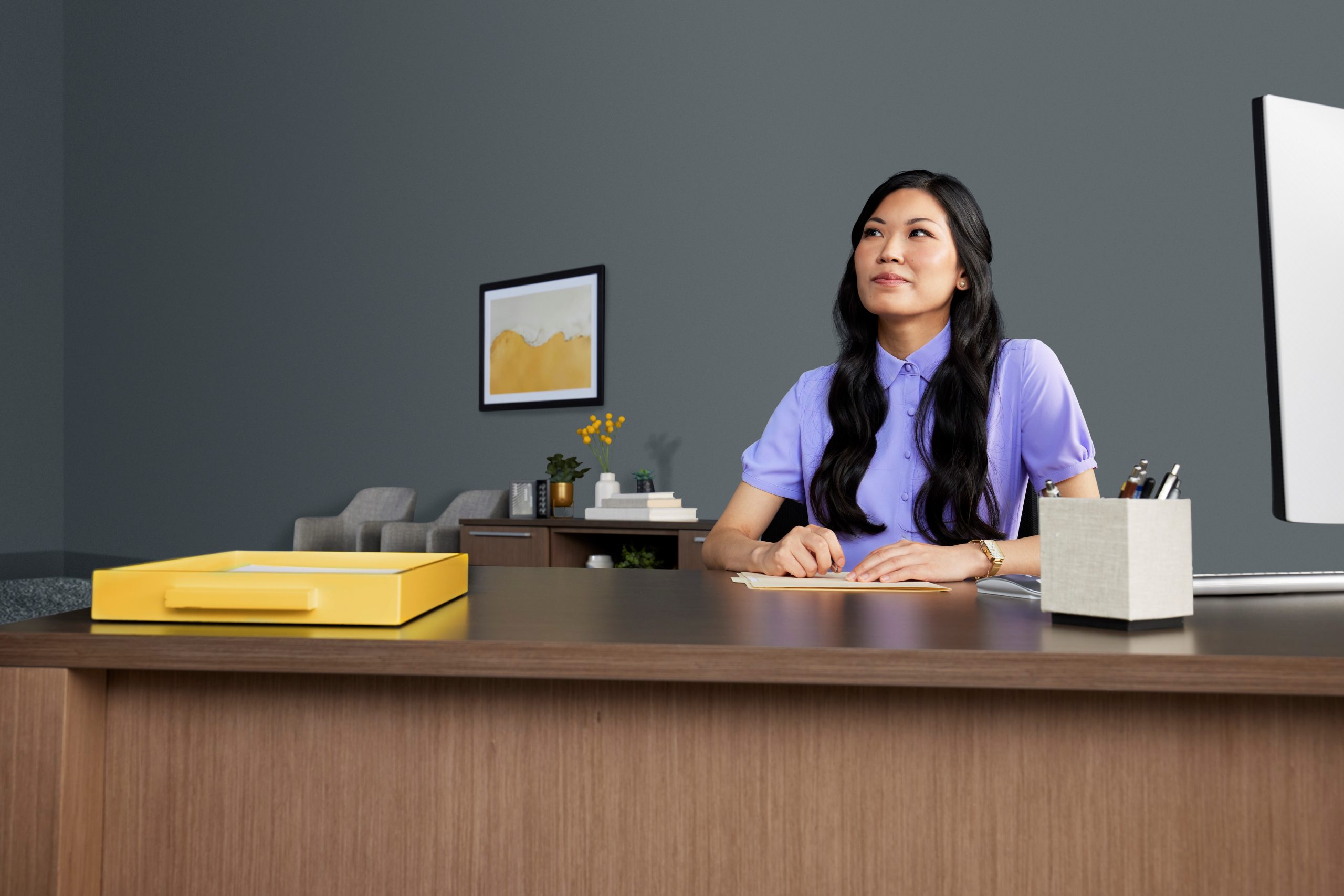 Female financial advisor at desk.