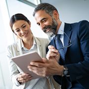 Two people looking at Ipad