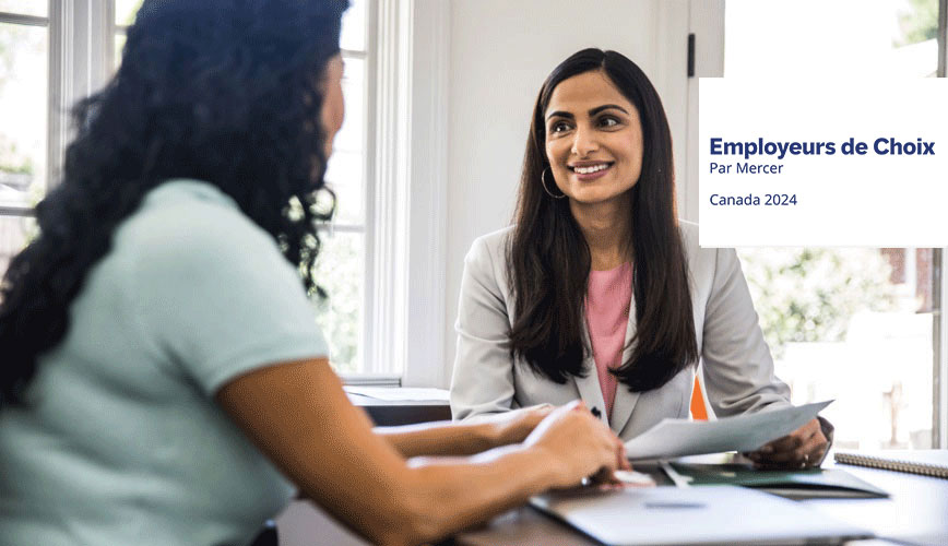 Two women having a discussions with Canada Best Employer By Mercer Logo