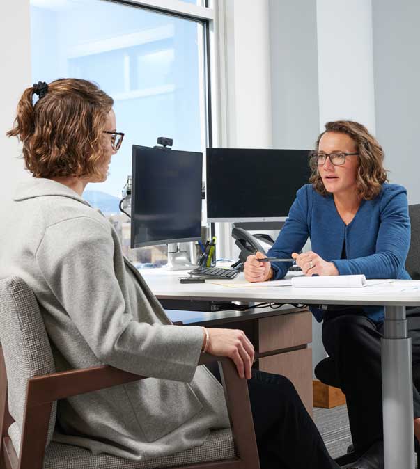 Two professional woman discussing.