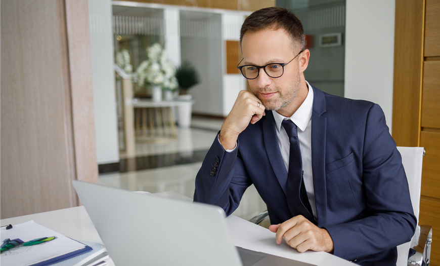 Man looking at his computer.