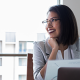 Business woman looking happy at work.