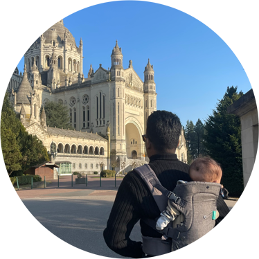 Chris Velasco , Financial Advisor, wraveling with his baby.