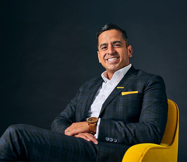 Financial Advisor Ernie Gamino smiling with confidence