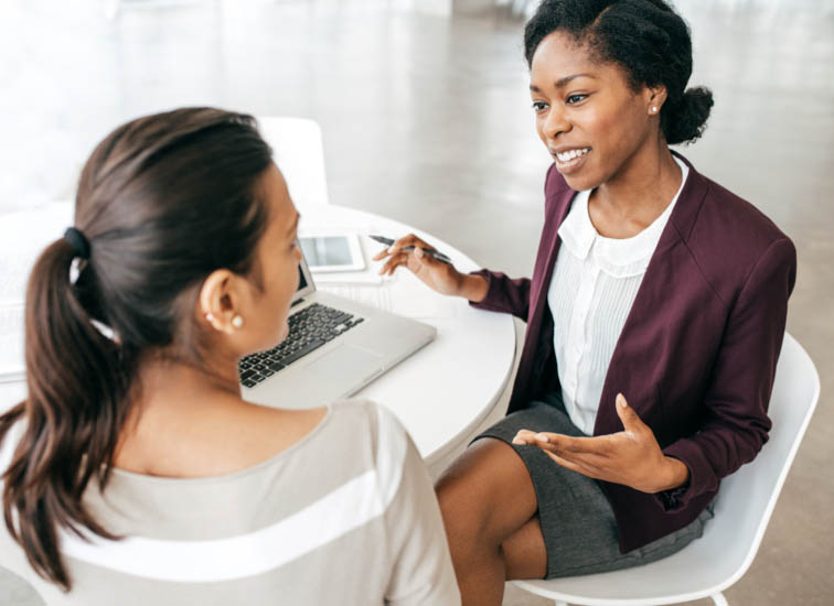 Two businesswomen discussing new plans