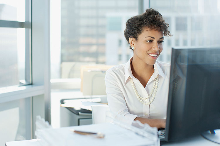 business woman at desk computer