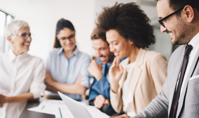 Smiling employees training together.
