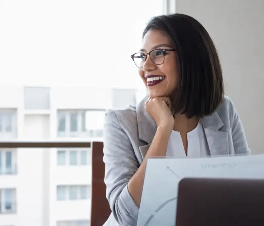 Business woman looking happy at work.