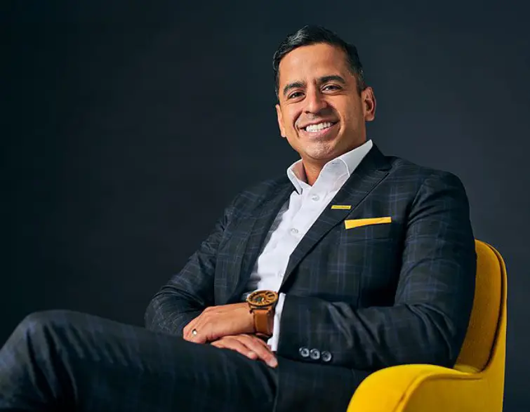 Financial Advisor Ernie Gamino smiling with confidence